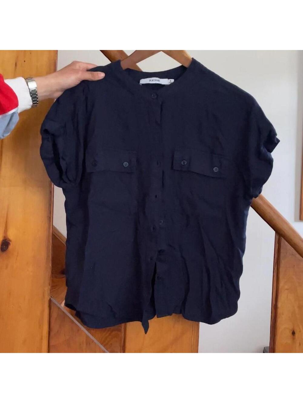 Navy blue button up shirt with short sleeves. justfab size small